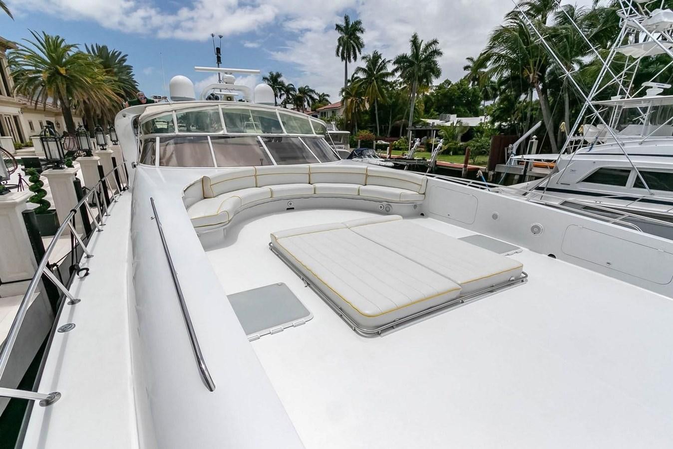 a boat with a deck and a pool on the deck aboard PURELY PLEASURE Yacht for Sale