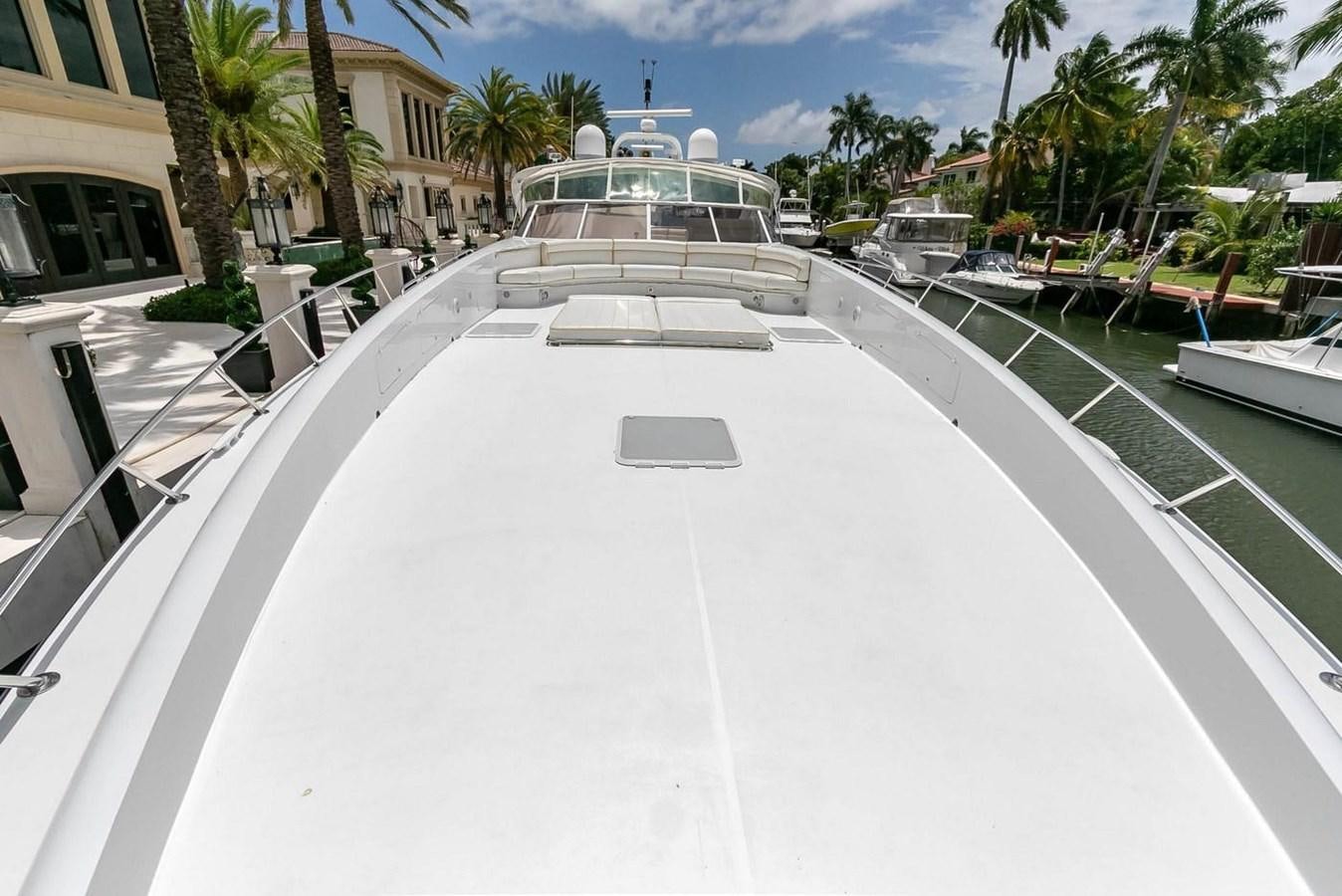 a pool with a deck and a pool aboard PURELY PLEASURE Yacht for Sale