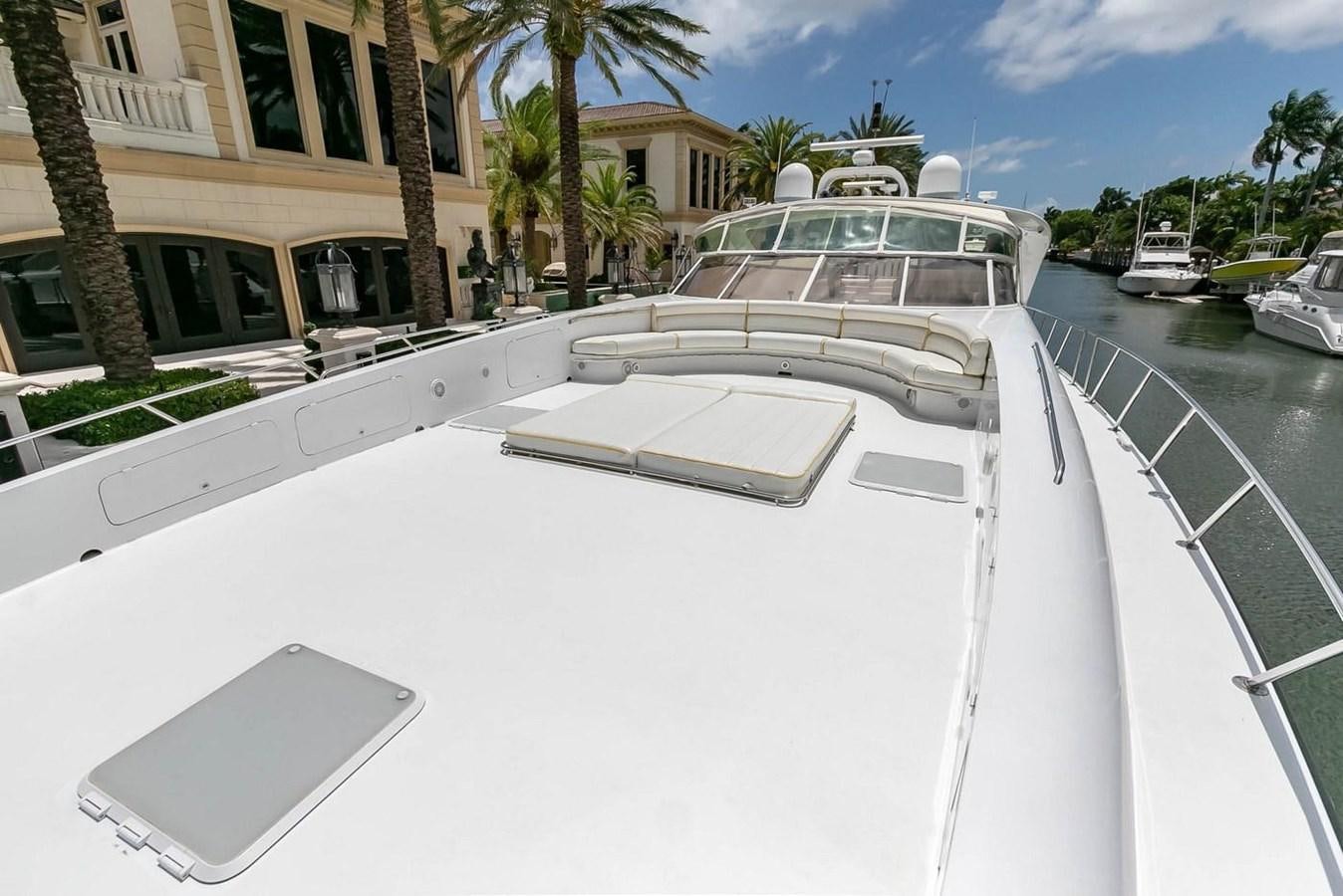 a white car parked on a street aboard PURELY PLEASURE Yacht for Sale