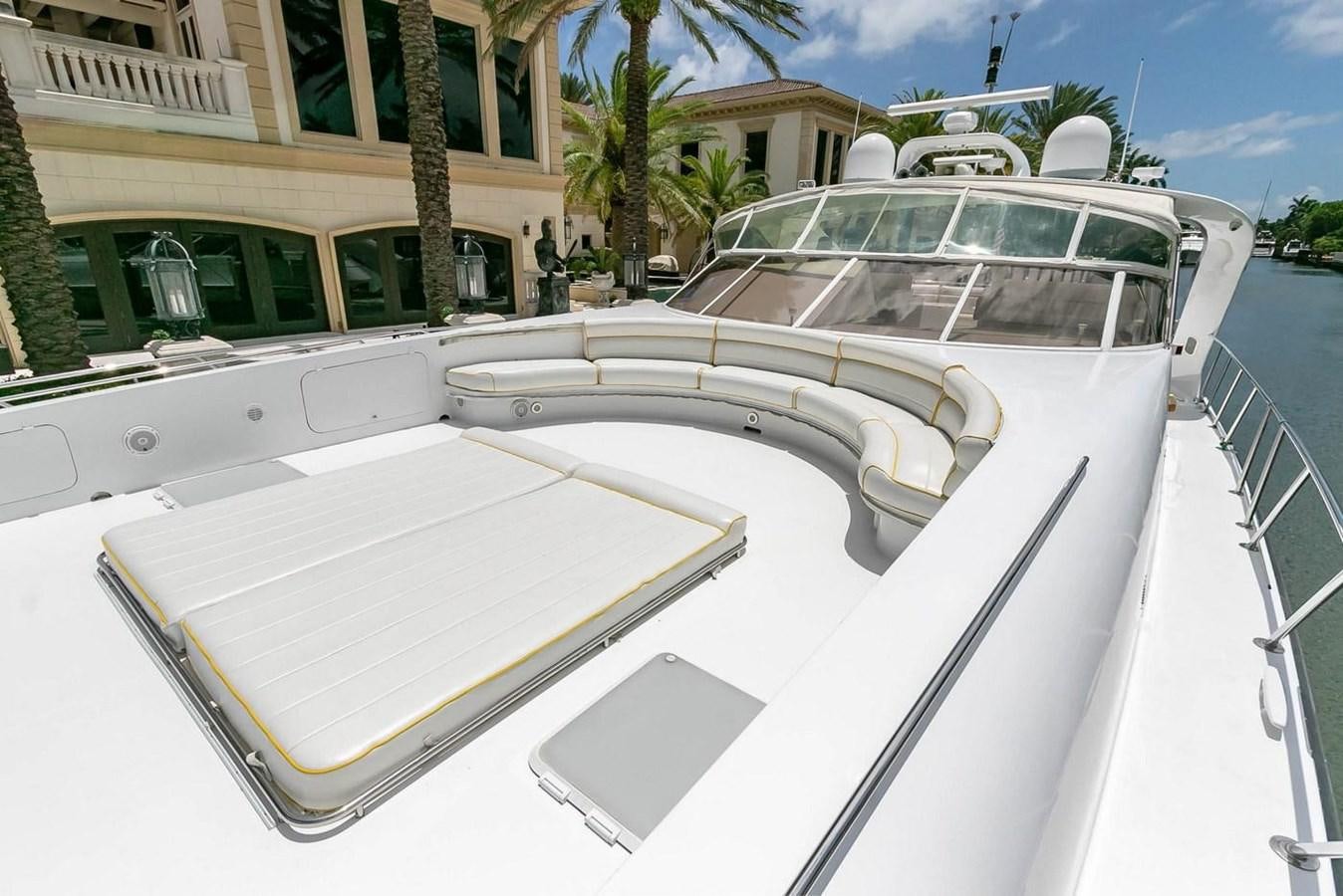 a white car parked on a street aboard PURELY PLEASURE Yacht for Sale