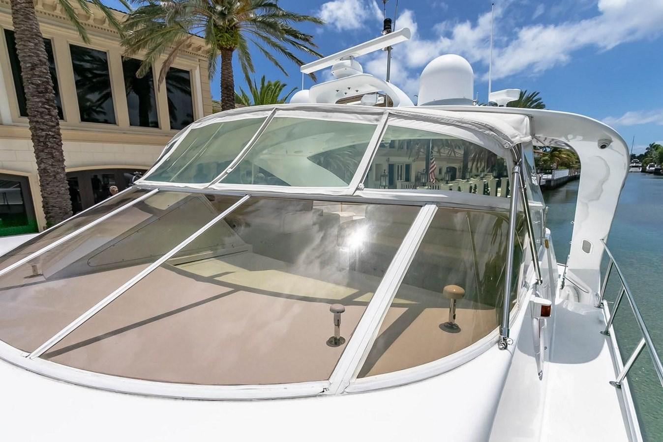 a white car with a large windshield aboard PURELY PLEASURE Yacht for Sale