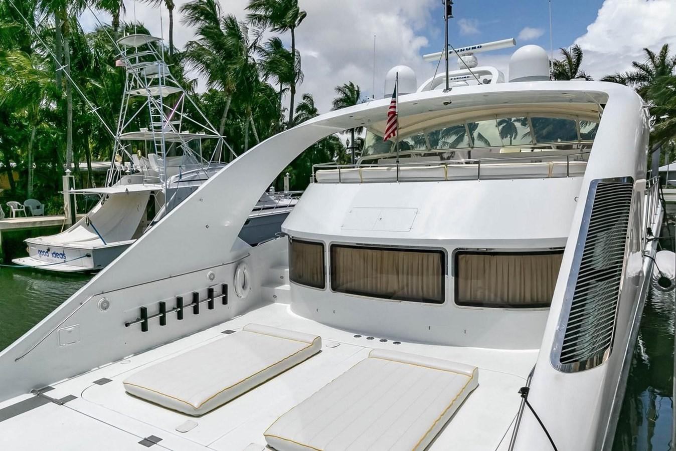 a boat with a flag on the front aboard PURELY PLEASURE Yacht for Sale