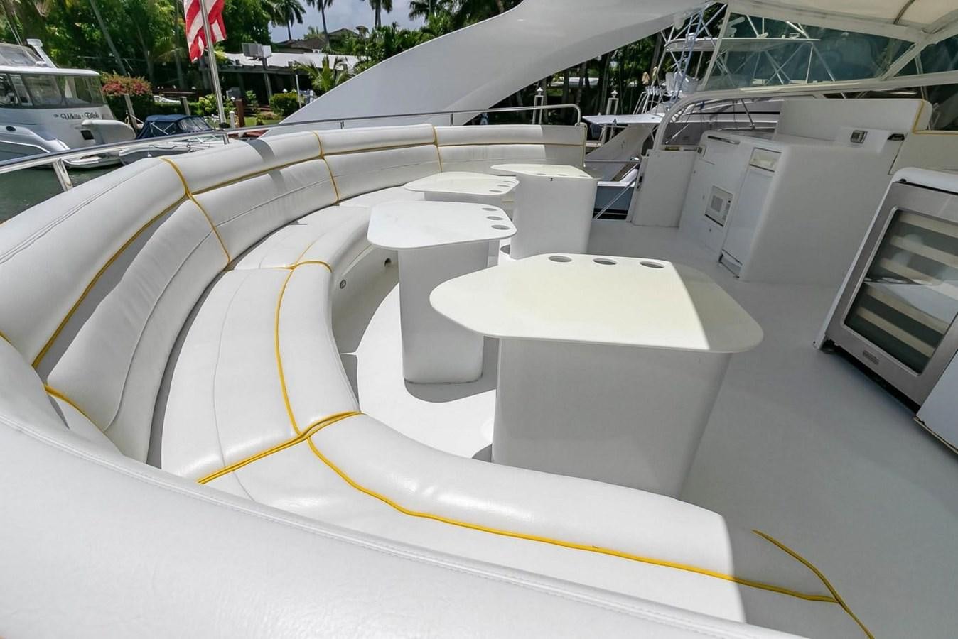 a white car with a yellow stripe aboard PURELY PLEASURE Yacht for Sale