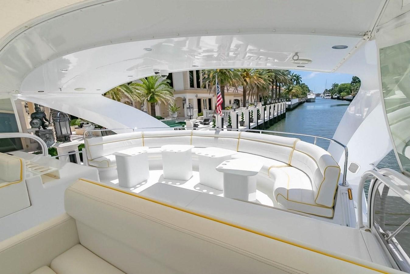 a pool with chairs and tables aboard PURELY PLEASURE Yacht for Sale