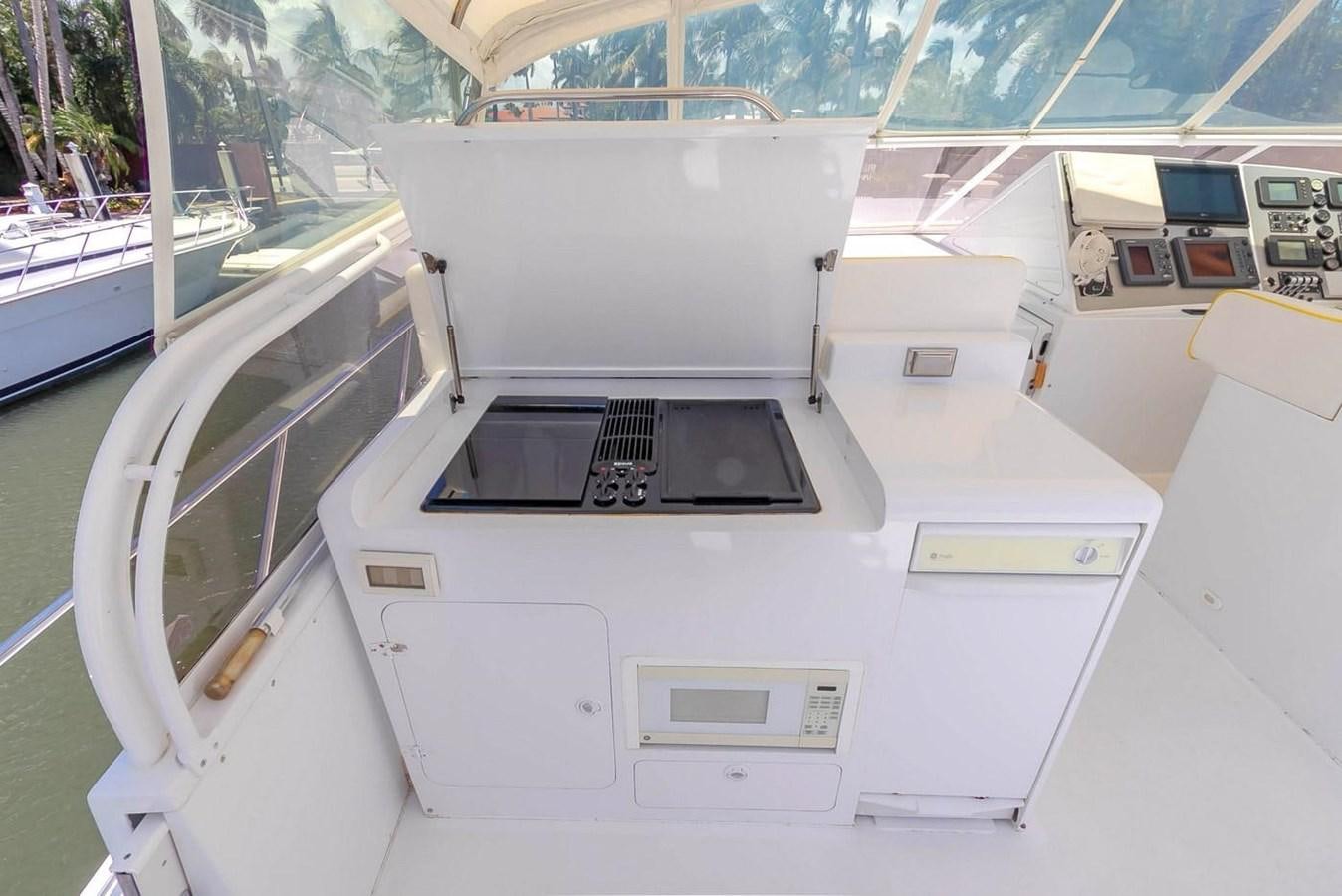 a white machine with a black screen aboard PURELY PLEASURE Yacht for Sale
