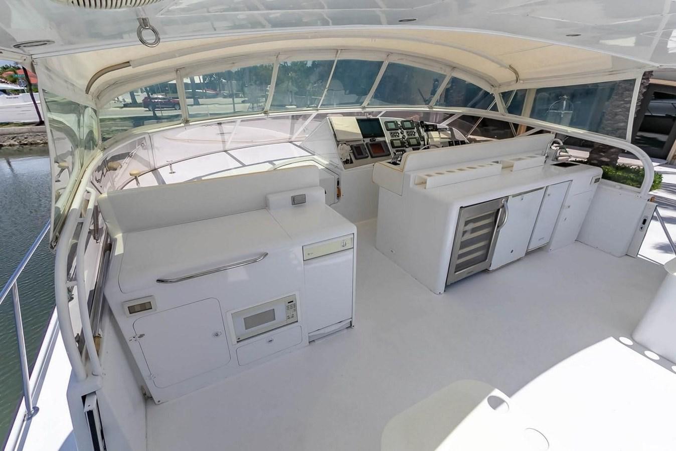 a large white room with a large window and a large white table aboard PURELY PLEASURE Yacht for Sale