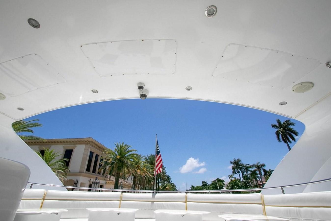 a white building with a flag on the roof aboard PURELY PLEASURE Yacht for Sale