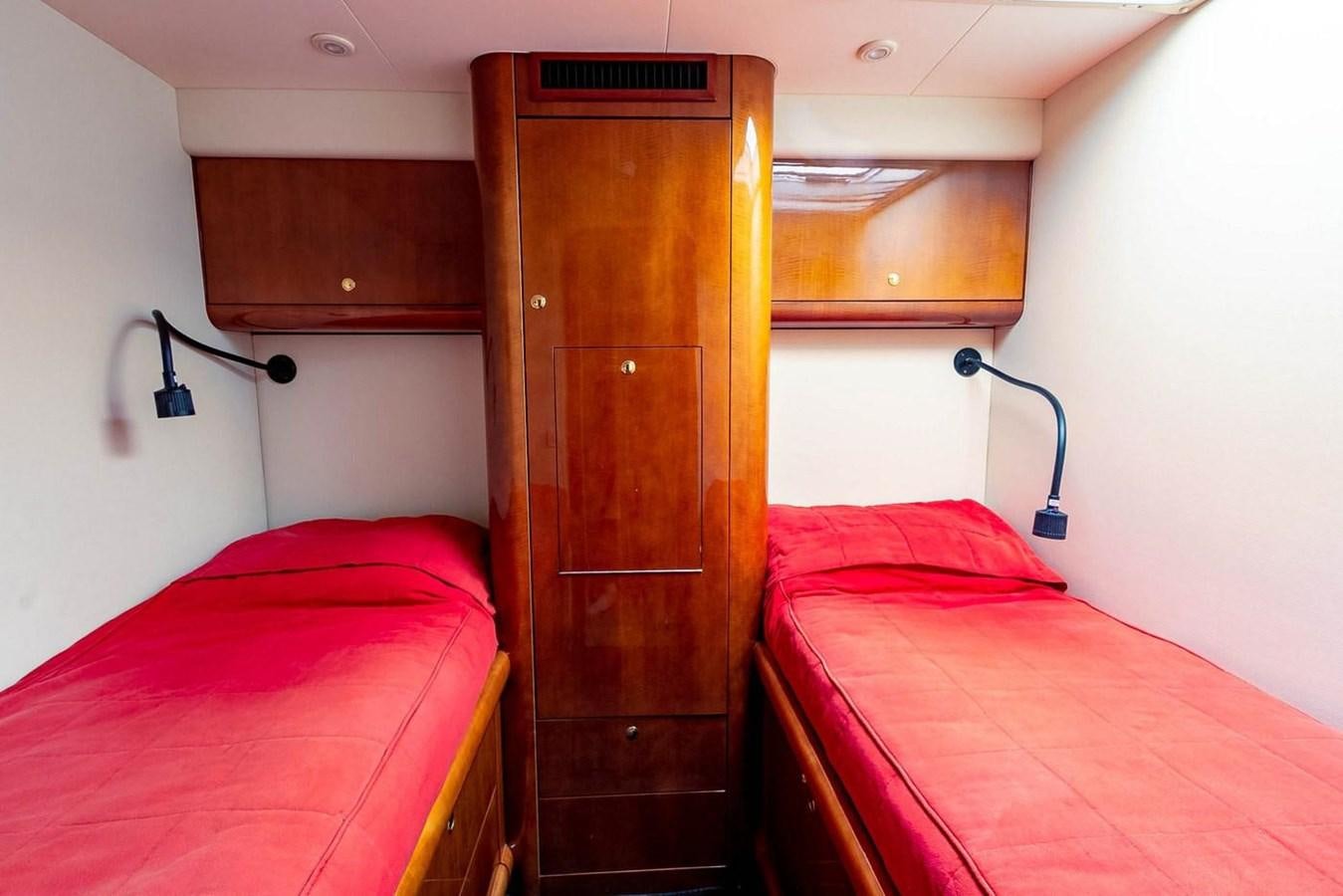 a room with two beds aboard PURELY PLEASURE Yacht for Sale