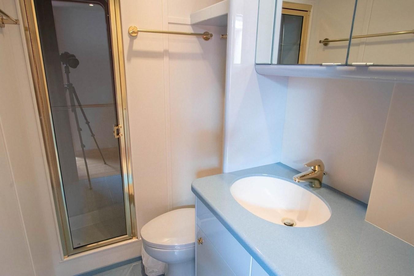 a bathroom with a sink and a toilet aboard PURELY PLEASURE Yacht for Sale