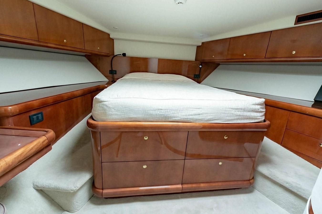 a bed in a room aboard PURELY PLEASURE Yacht for Sale
