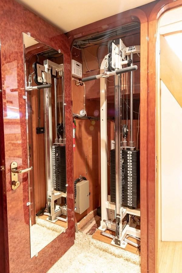 a room with a machine aboard PURELY PLEASURE Yacht for Sale