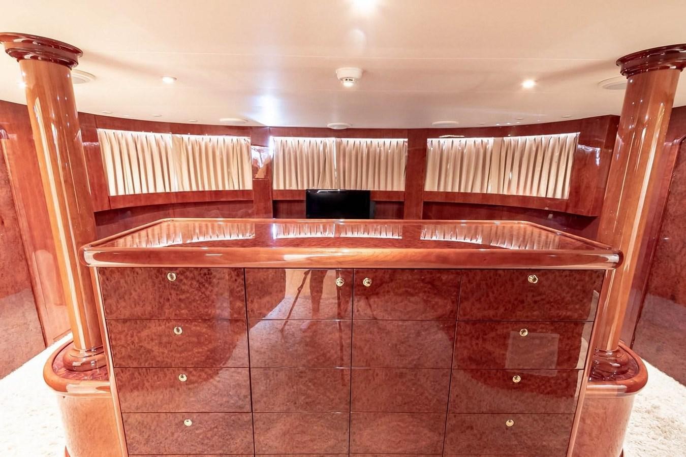 a wooden bunk bed aboard PURELY PLEASURE Yacht for Sale