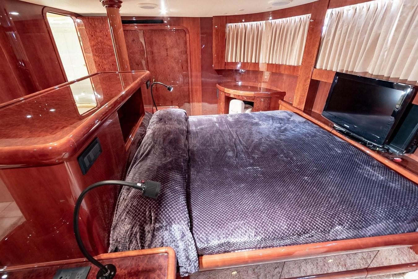 a bed in a cabin aboard PURELY PLEASURE Yacht for Sale