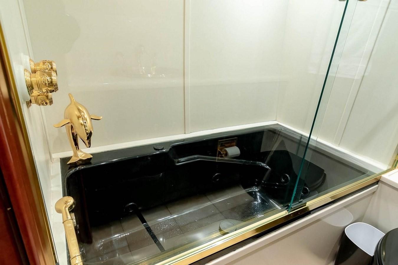a toy figurine on a shelf in a bathroom aboard PURELY PLEASURE Yacht for Sale