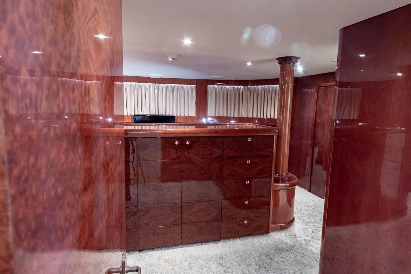 a room with a piano and curtains aboard PURELY PLEASURE Yacht for Sale