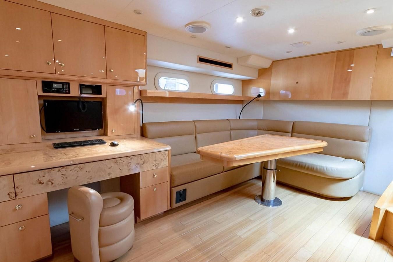 a room with a bed and a desk aboard PURELY PLEASURE Yacht for Sale