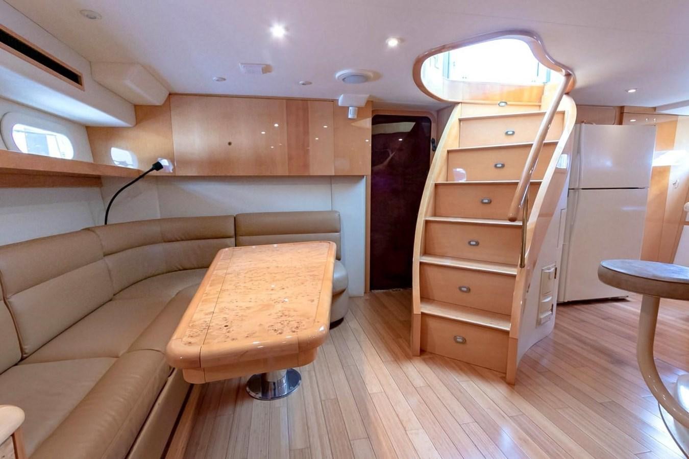 a room with a bed and a desk aboard PURELY PLEASURE Yacht for Sale