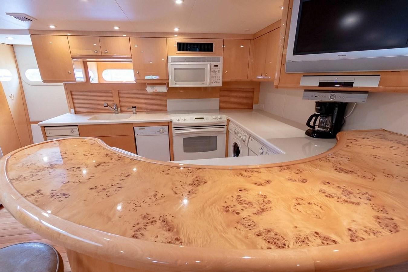 a kitchen with a large marble counter top aboard PURELY PLEASURE Yacht for Sale