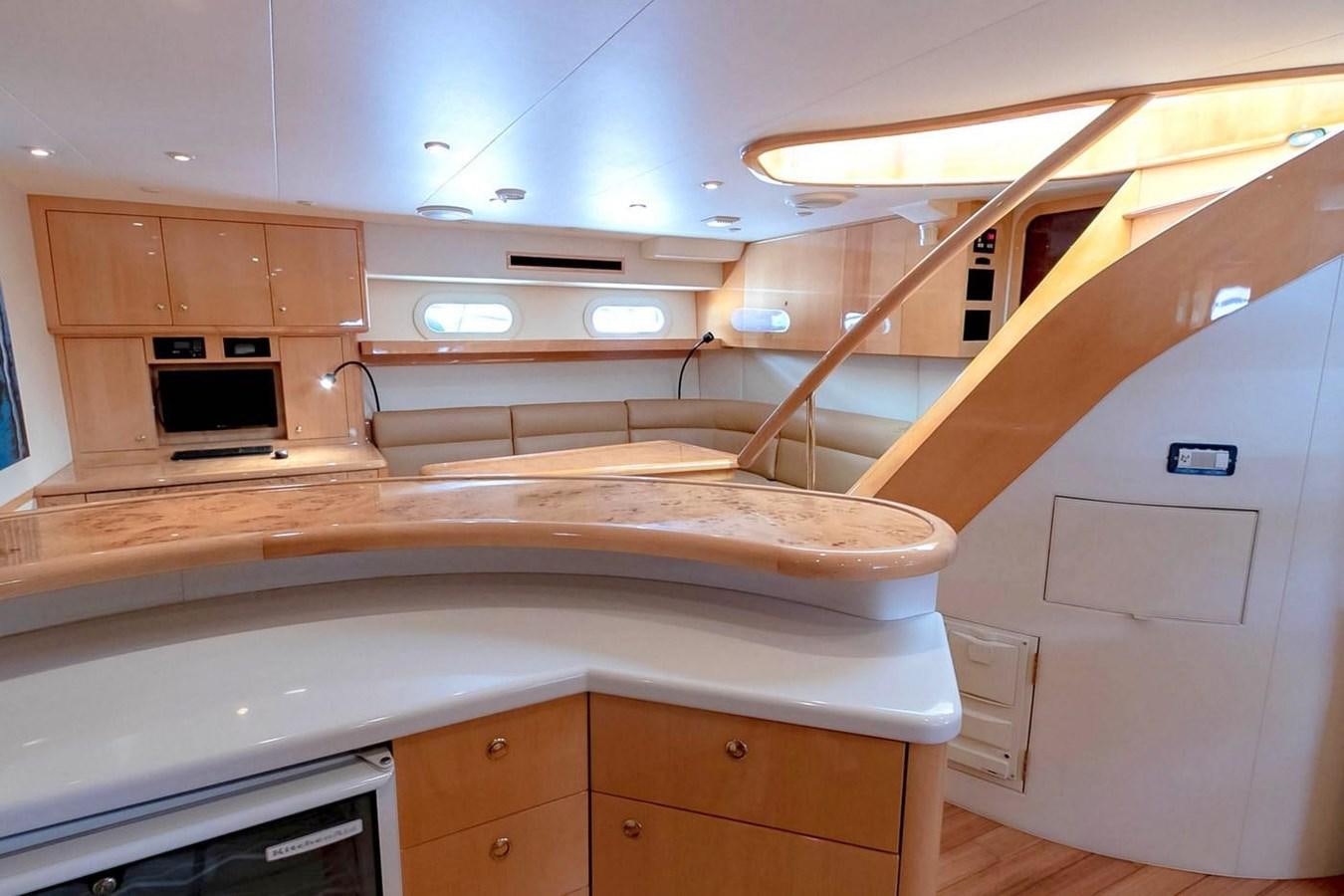 a kitchen with a large island aboard PURELY PLEASURE Yacht for Sale