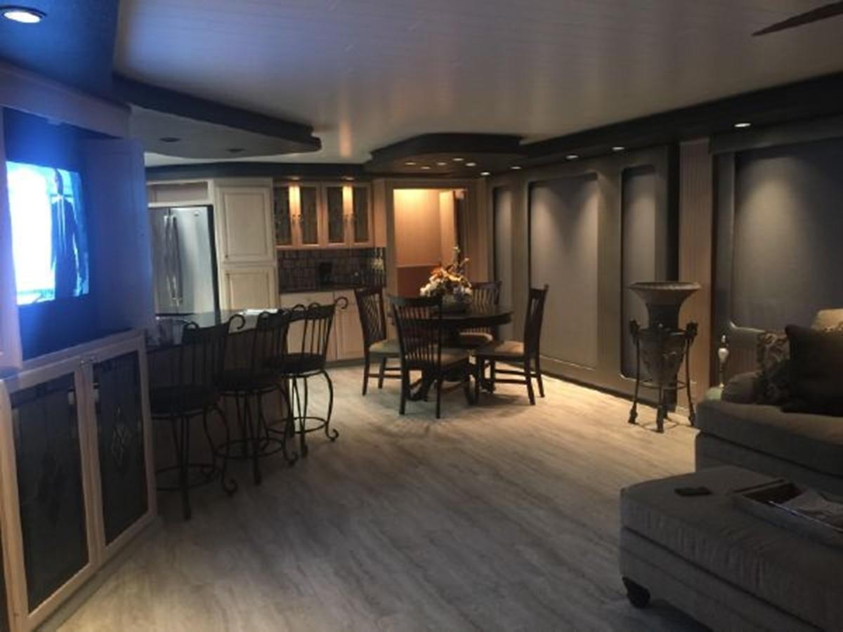 a living room with a couch and chairs aboard SUMERSET HOUSEBOAT Yacht for Sale