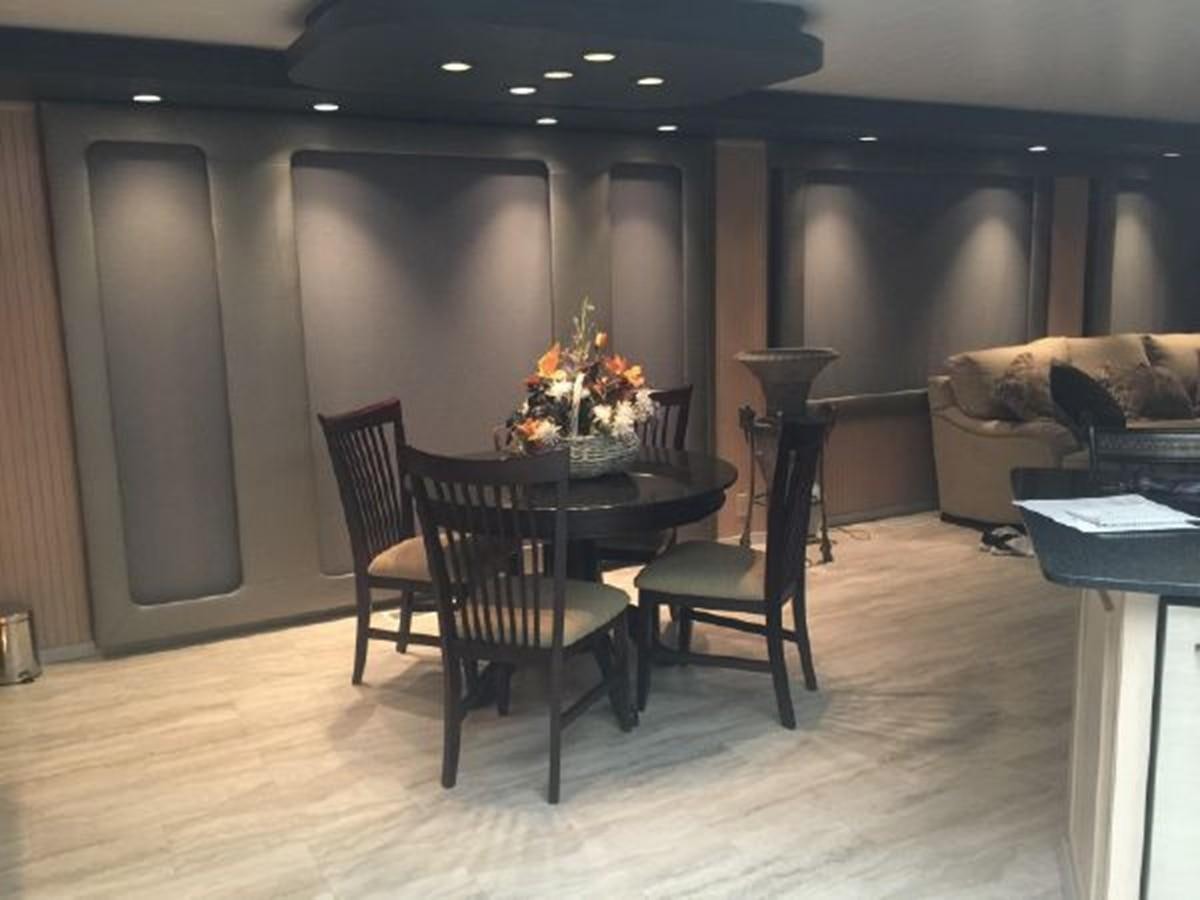 a room with a table and chairs aboard SUMERSET HOUSEBOAT Yacht for Sale