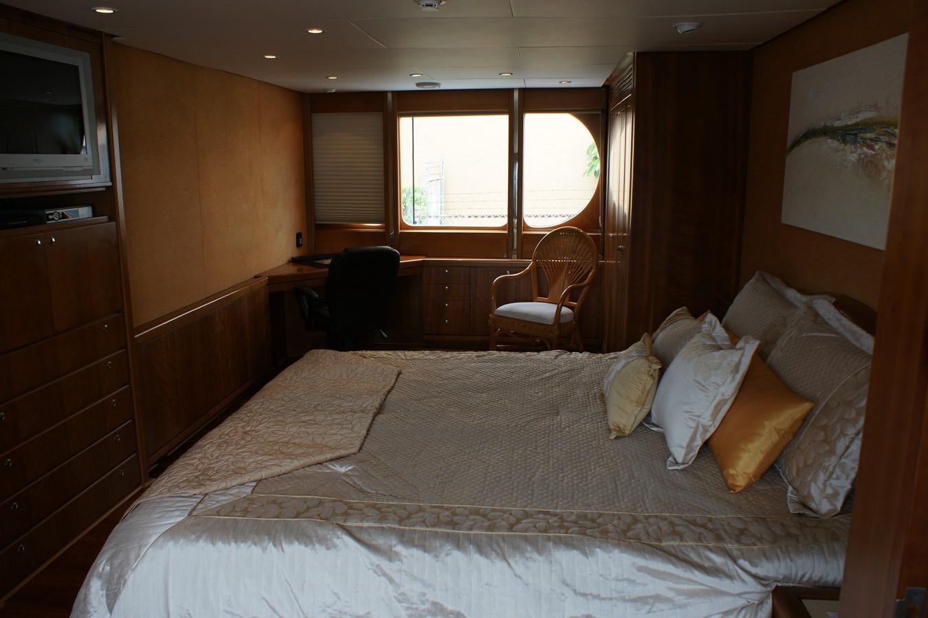 a bed with pillows and blankets aboard FORTALEZA Yacht for Sale