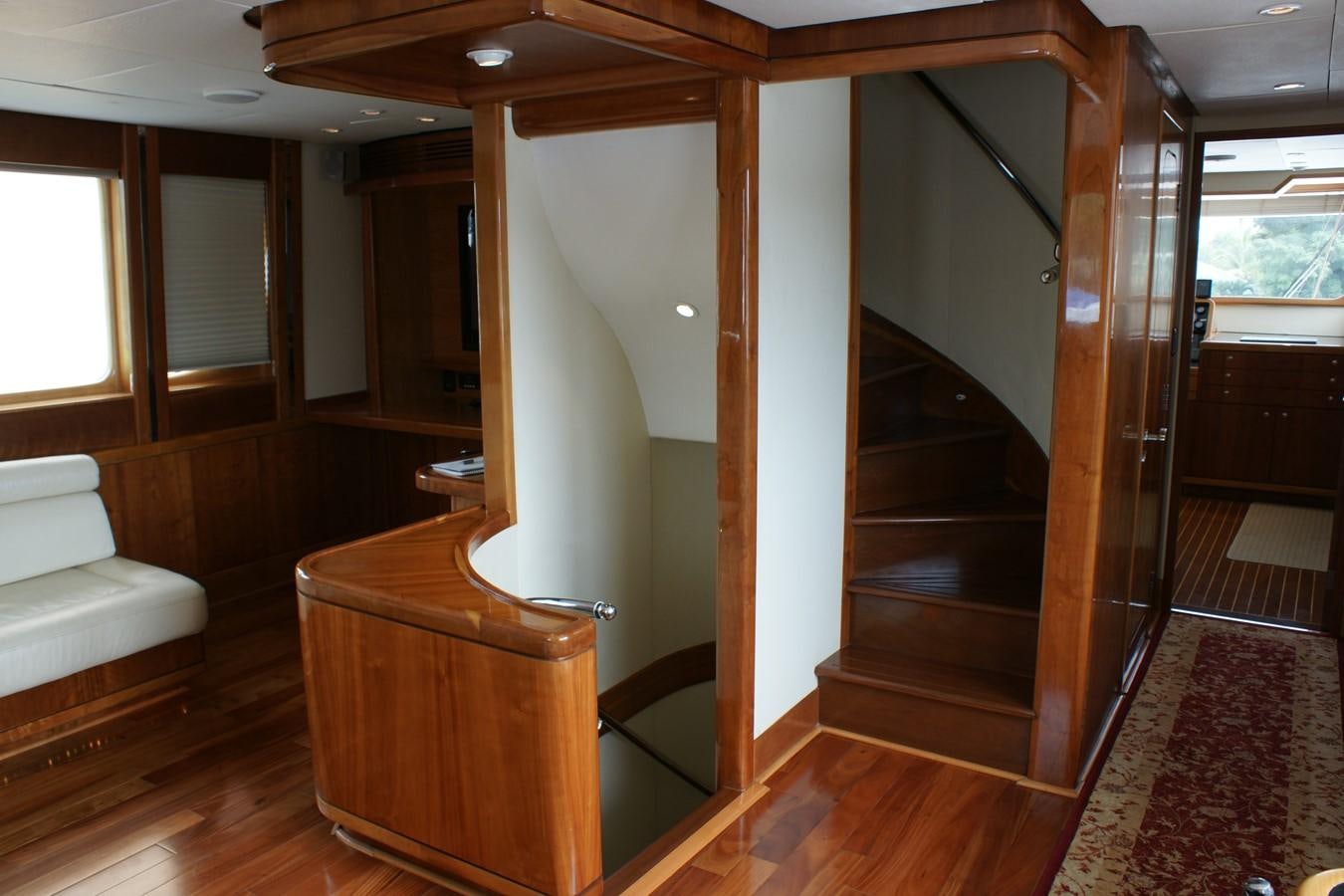 a room with a wood door and a wood staircase aboard FORTALEZA Yacht for Sale