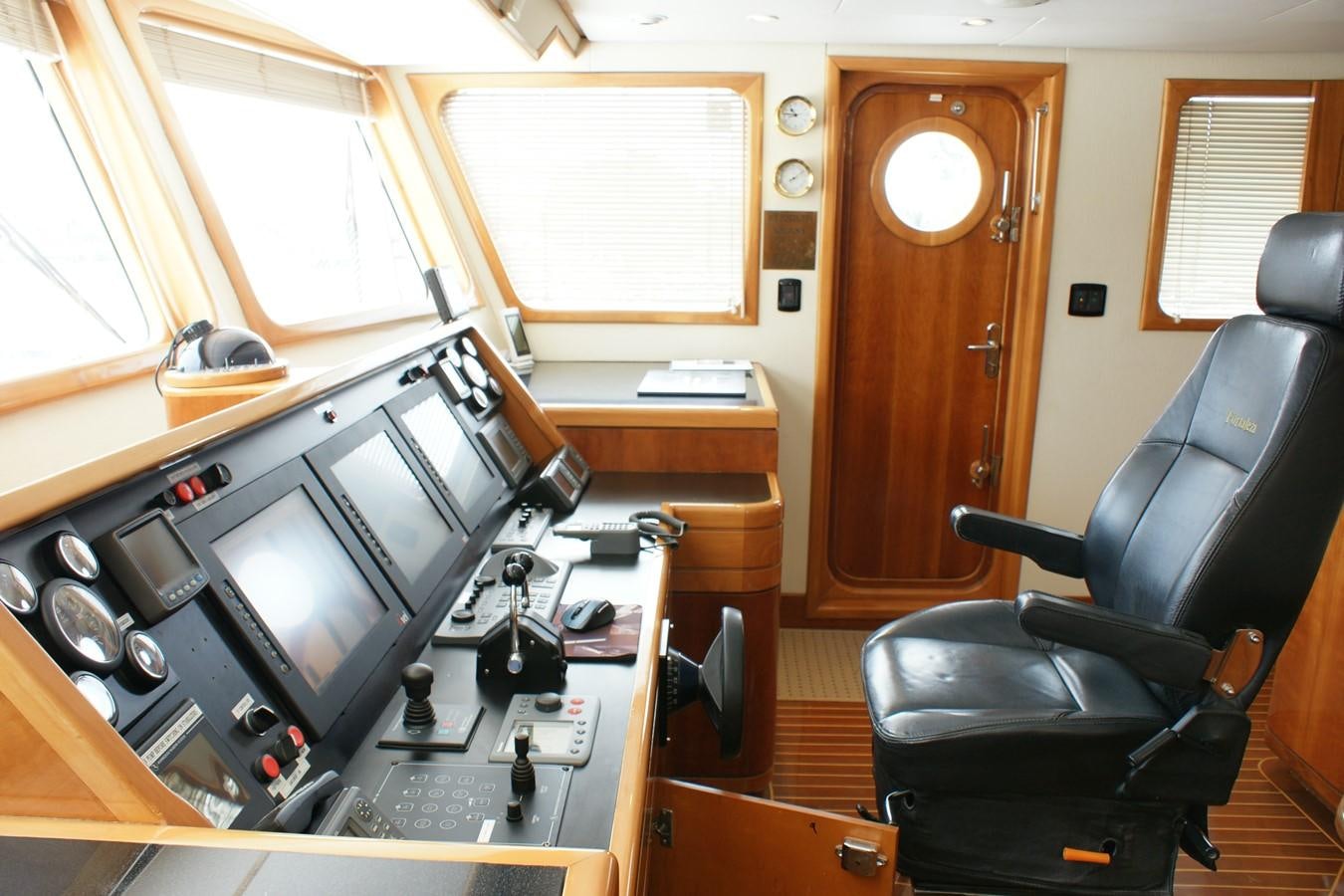 a room with a desk and computer aboard FORTALEZA Yacht for Sale
