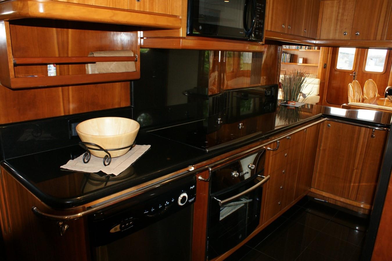 a kitchen with a bowl on the stove aboard FORTALEZA Yacht for Sale