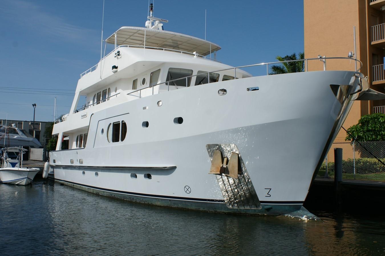 a large white boat docked aboard FORTALEZA Yacht for Sale