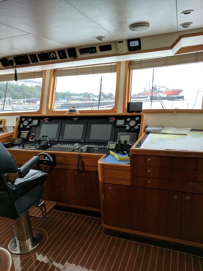 a room with computers and chairs aboard FORTALEZA Yacht for Sale