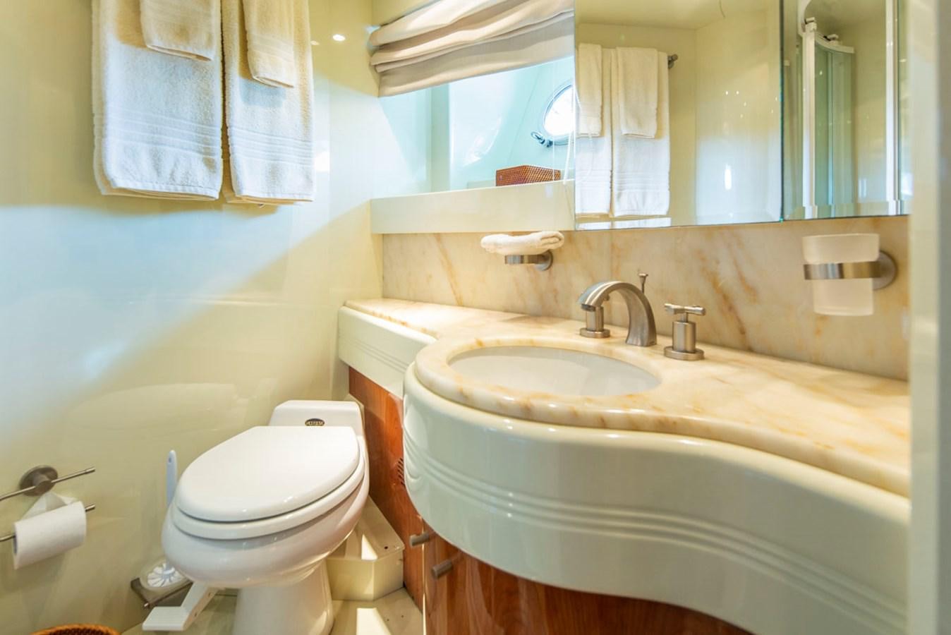 a bathroom with a sink toilet and a bathtub aboard SEA HAWK Yacht for Sale