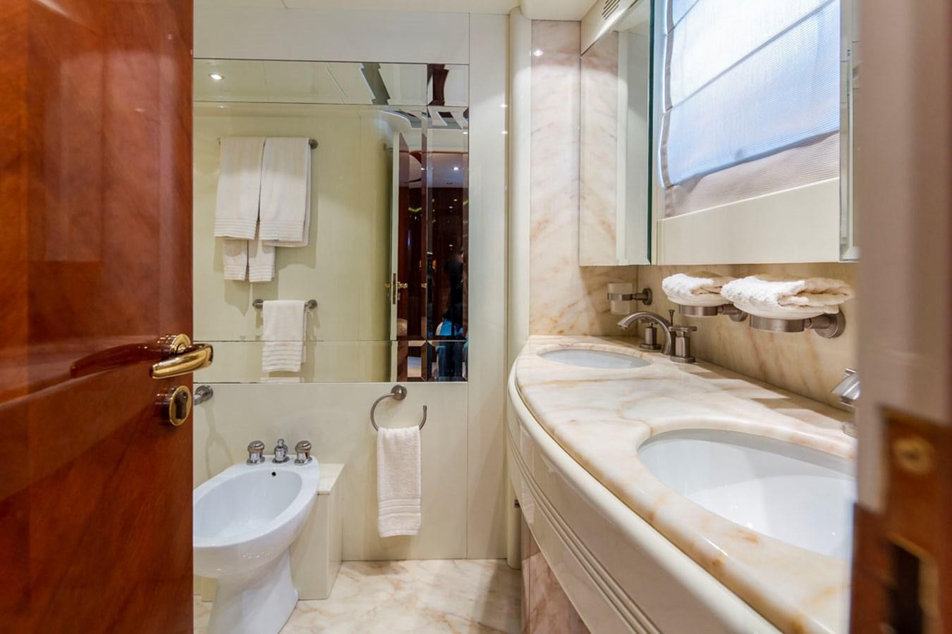 a bathroom with a sink and a mirror aboard SEA HAWK Yacht for Sale