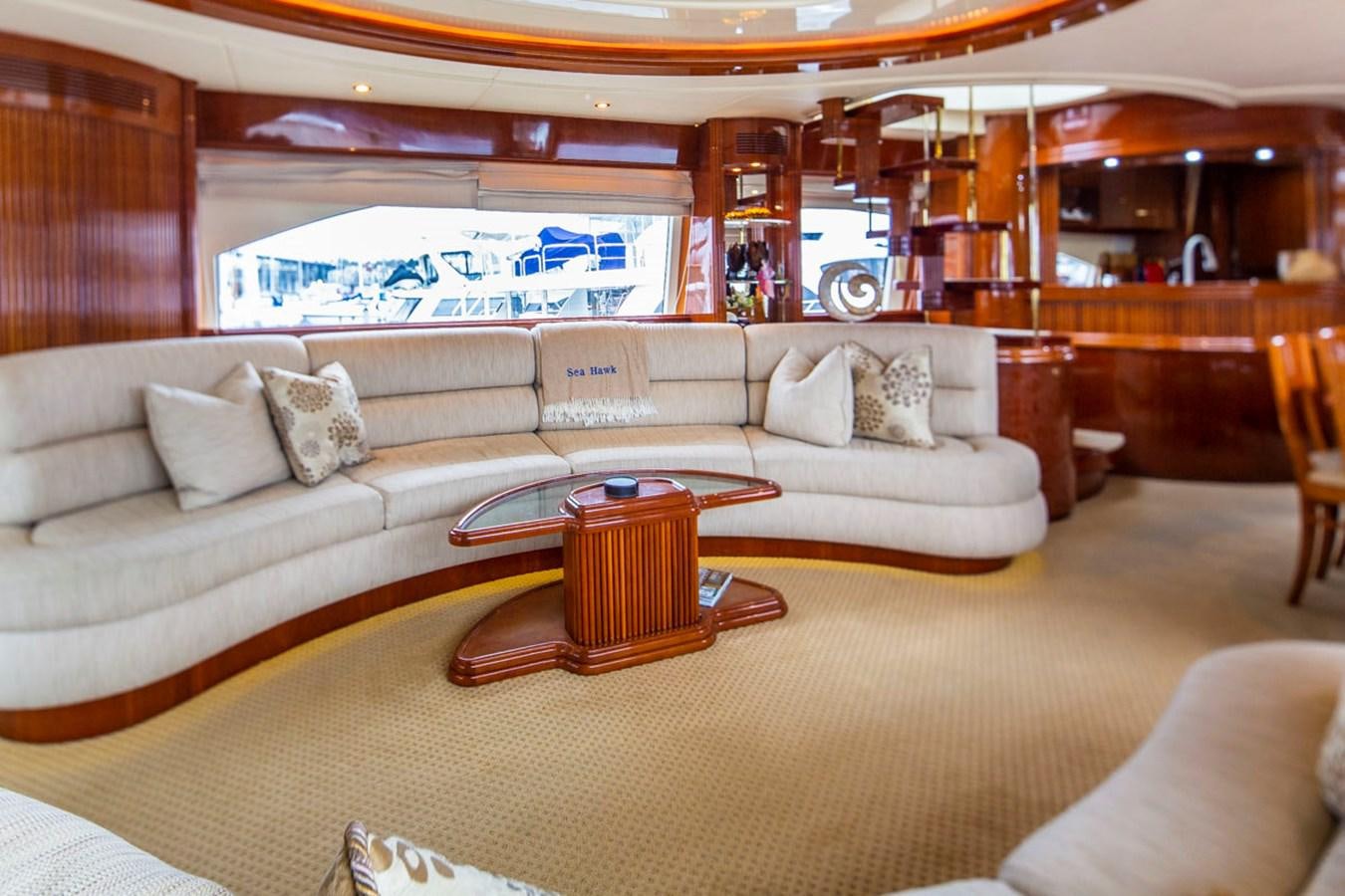 a living room with a couch and a coffee table aboard SEA HAWK Yacht for Sale