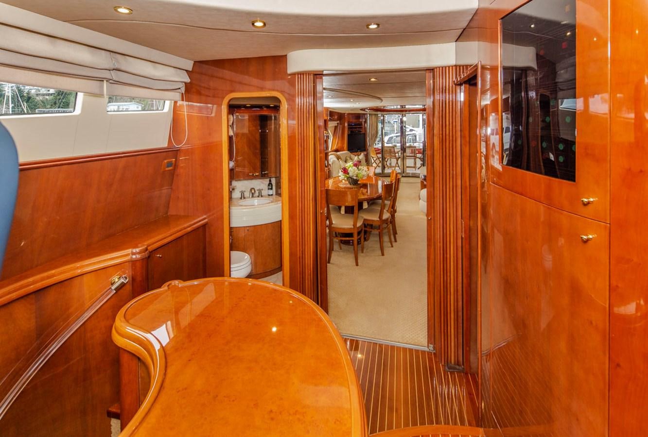 a room with a table and chairs aboard SEA HAWK Yacht for Sale