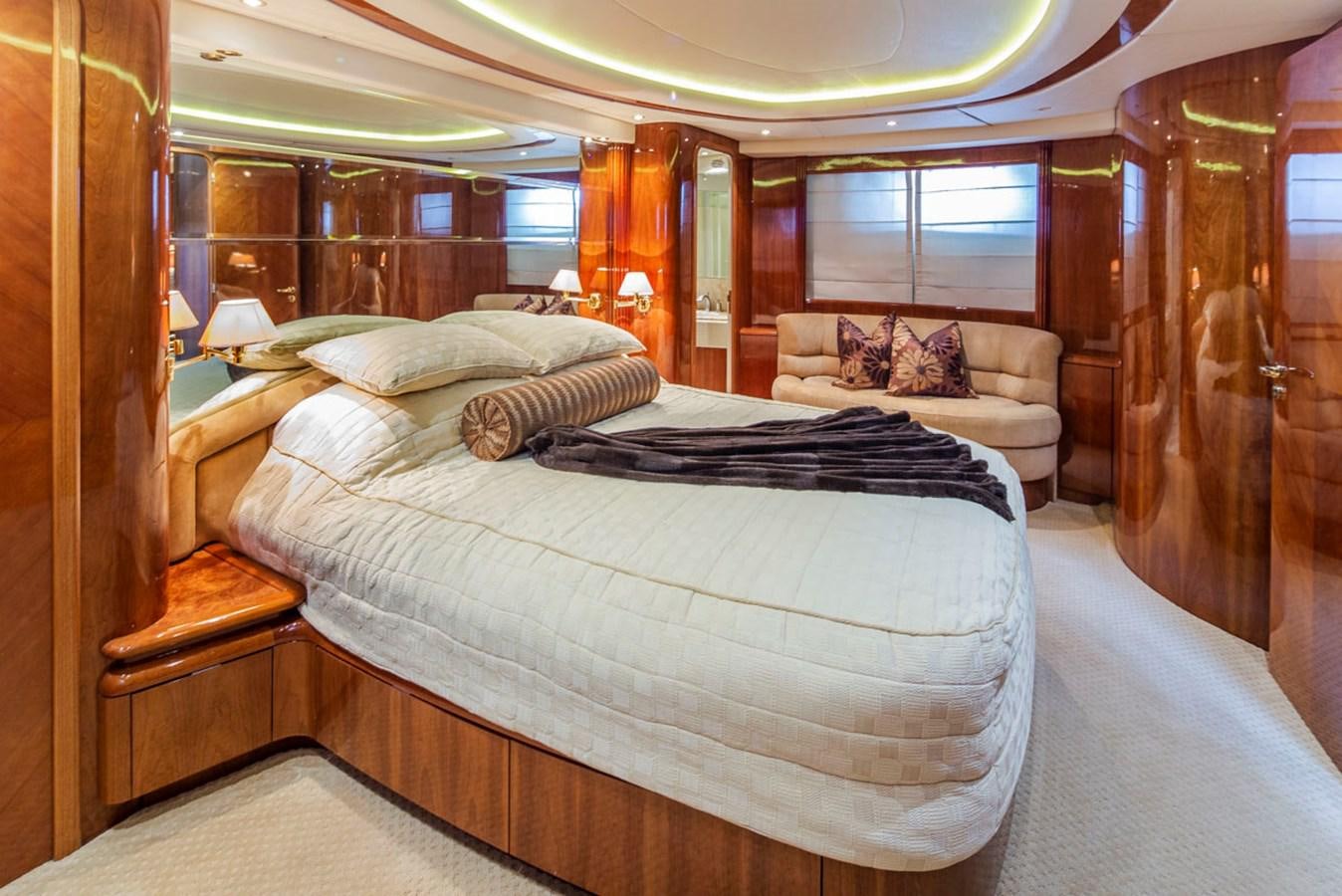 a bedroom with a bed and a couch aboard SEA HAWK Yacht for Sale
