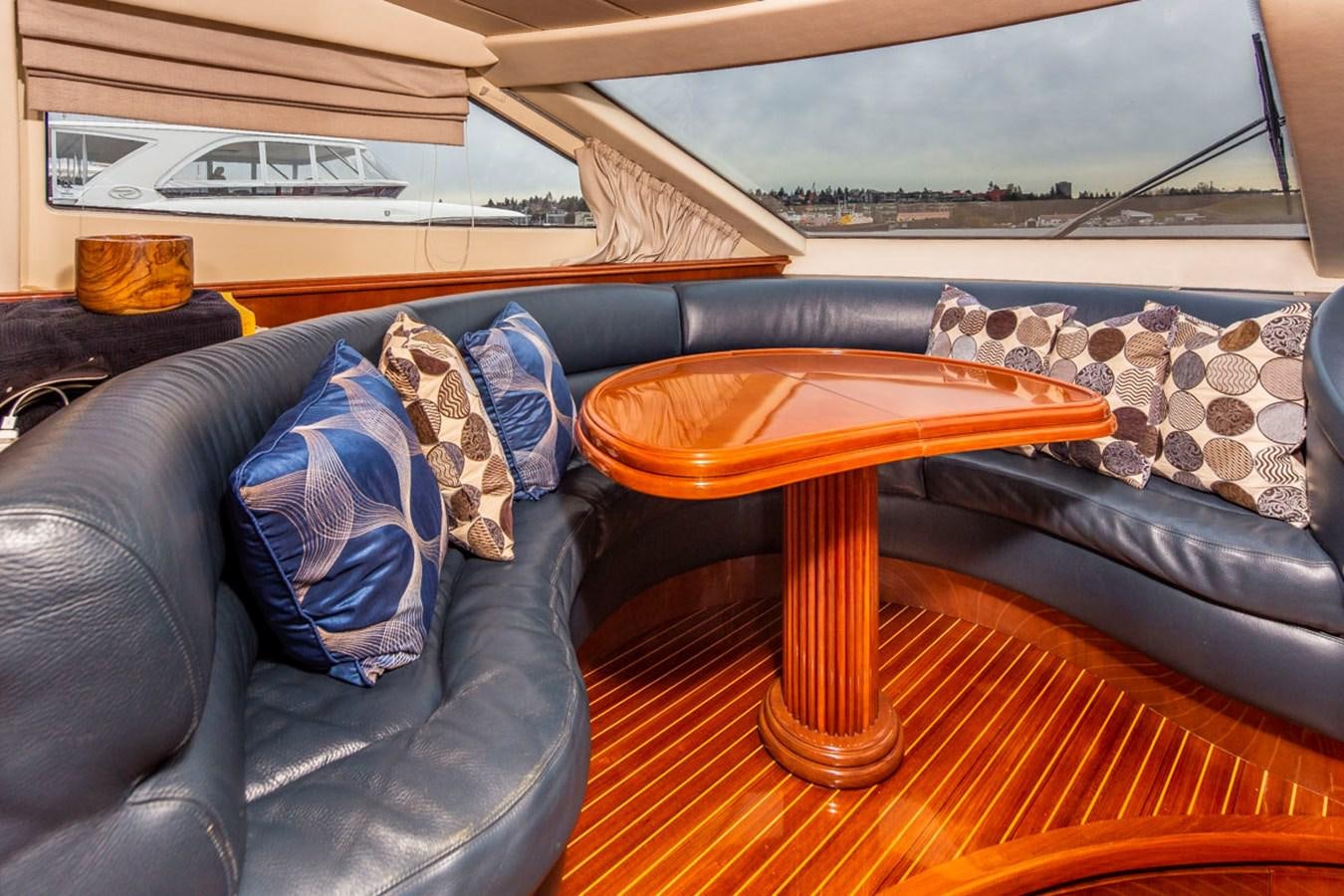 a table and a couch in a room aboard SEA HAWK Yacht for Sale