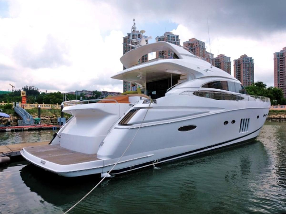 a white boat docked aboard PRINCESS V85 Yacht for Sale