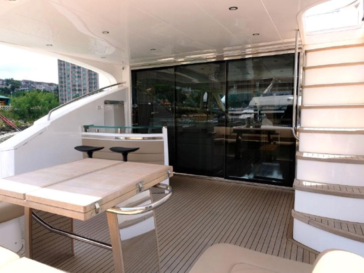 a room with a table and chairs aboard PRINCESS V85 Yacht for Sale