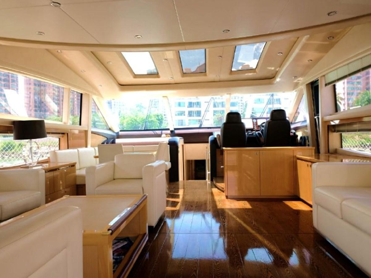 a room with a table chairs and a window aboard PRINCESS V85 Yacht for Sale