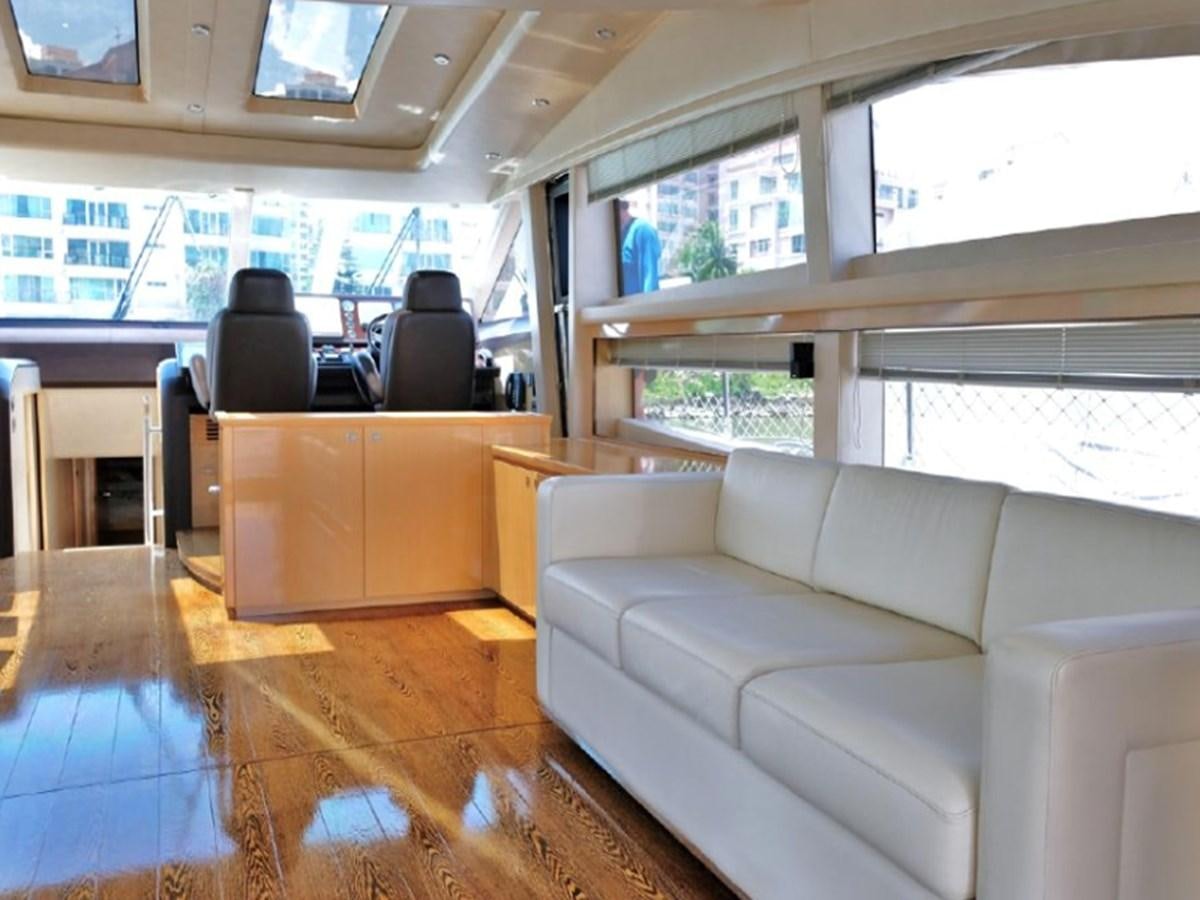a room with a couch and a table aboard PRINCESS V85 Yacht for Sale