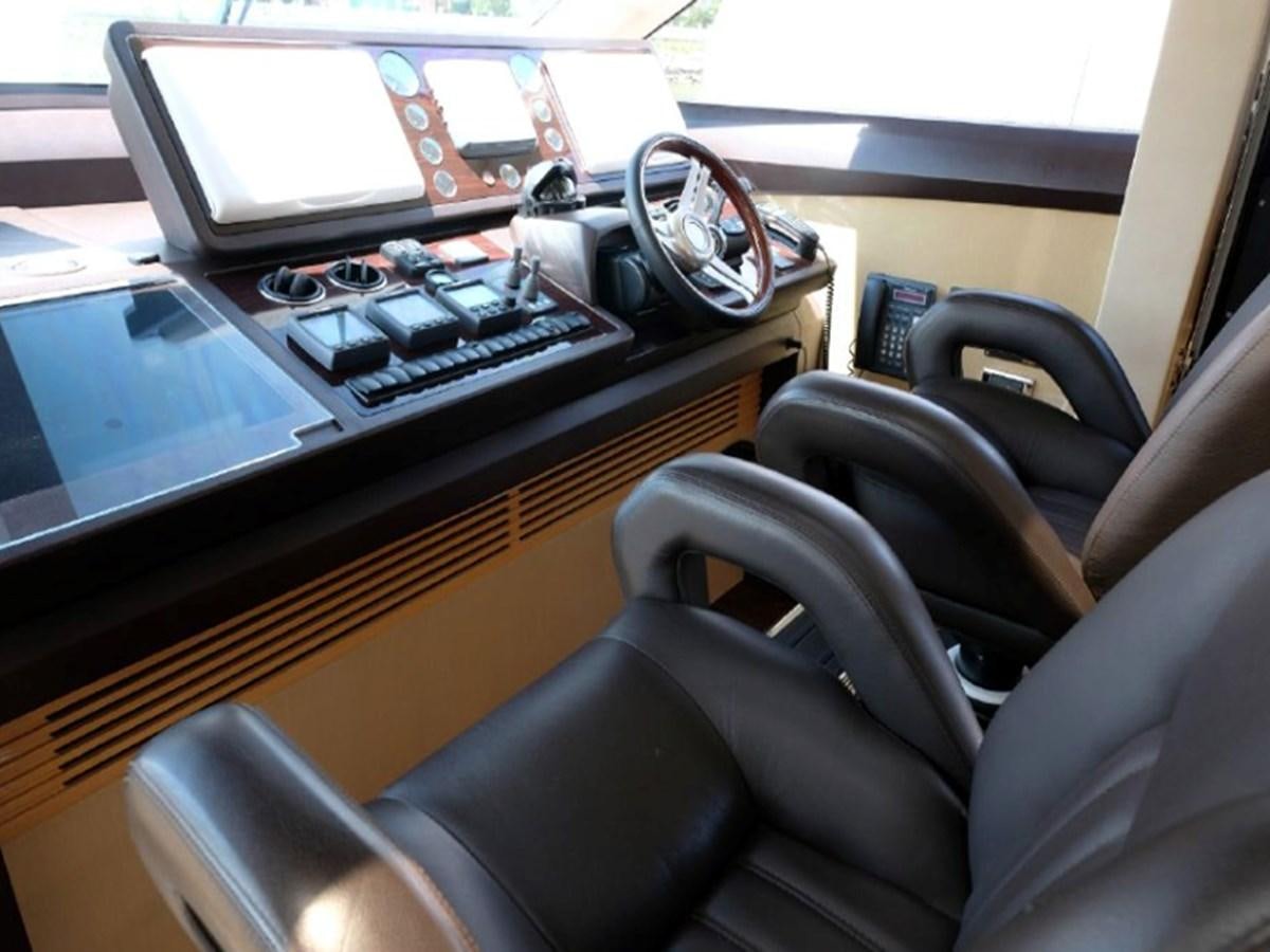 a desk with a laptop and a keyboard on it aboard PRINCESS V85 Yacht for Sale