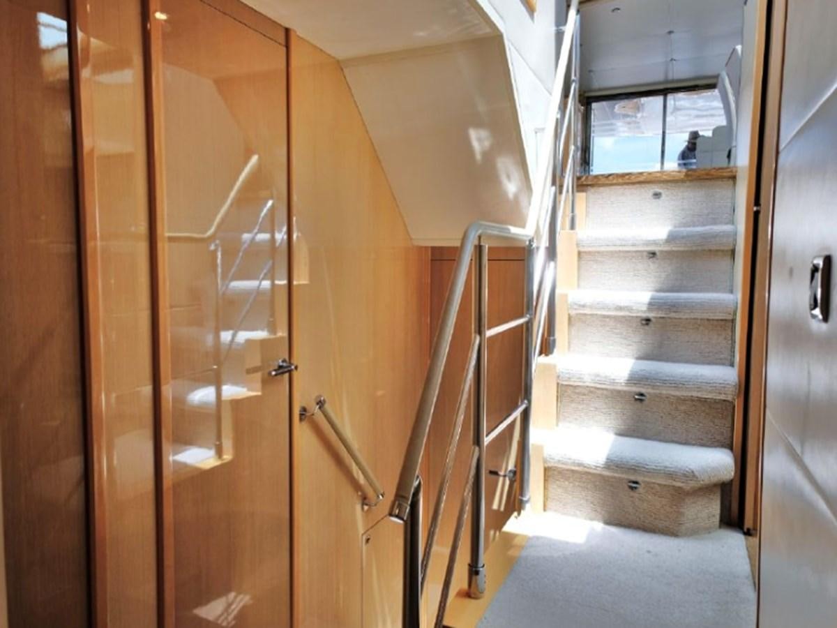 a wooden staircase in a house aboard PRINCESS V85 Yacht for Sale