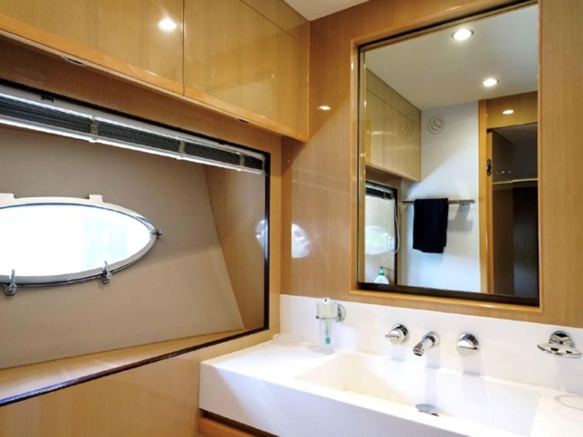 a bathroom with a large mirror aboard PRINCESS V85 Yacht for Sale