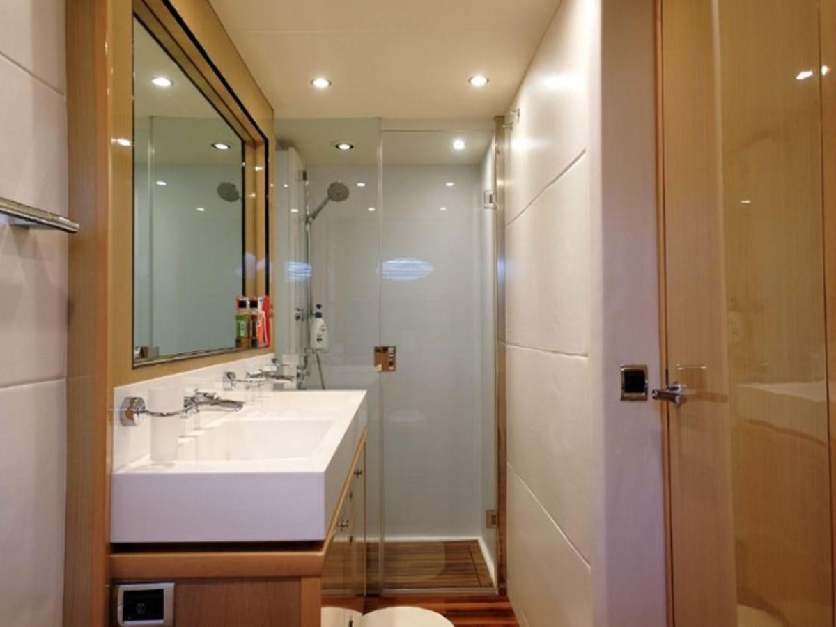 a bathroom with a large mirror aboard PRINCESS V85 Yacht for Sale