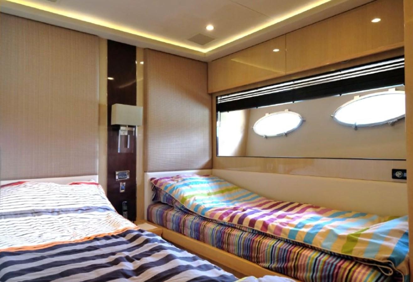 a room with two beds aboard PRINCESS V85 Yacht for Sale
