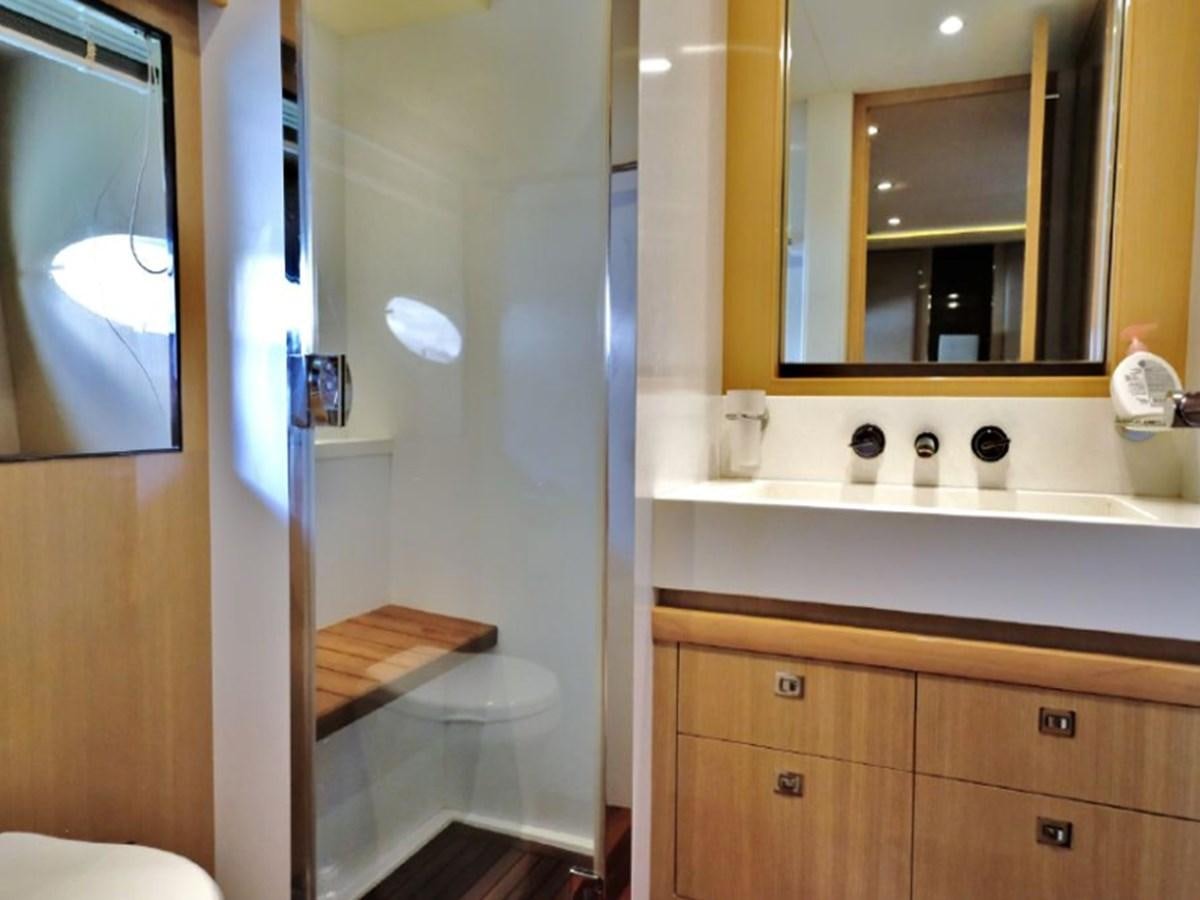 a bathroom with a large mirror aboard PRINCESS V85 Yacht for Sale