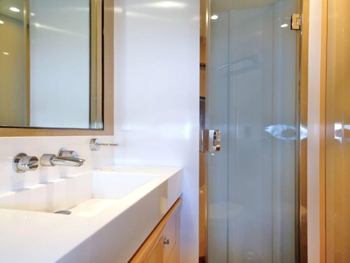 a bathroom with a sink and a mirror aboard PRINCESS V85 Yacht for Sale