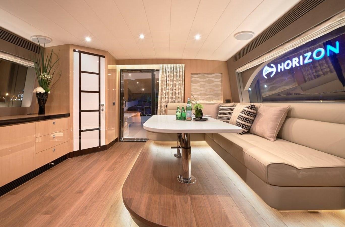 a living room with a table and couches aboard E84 (NEW BOAT SPEC)  Yacht for Sale