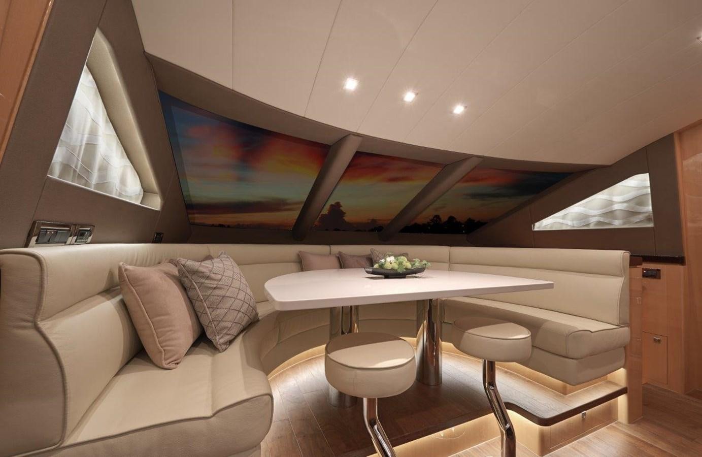a room with a table and chairs aboard E84 (NEW BOAT SPEC)  Yacht for Sale